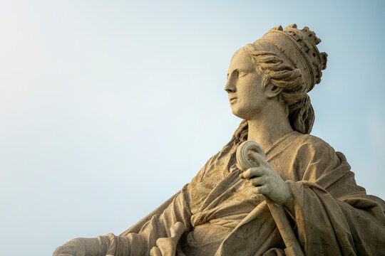 Statue of the goddess Cibeles and the lions in the city of Madrid, Spain, during a sunny summer day with few clouds	