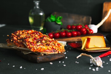 Pizza. Mini italian pizzas with cheese, pepper and tomatos. Pizza on wooden plate.