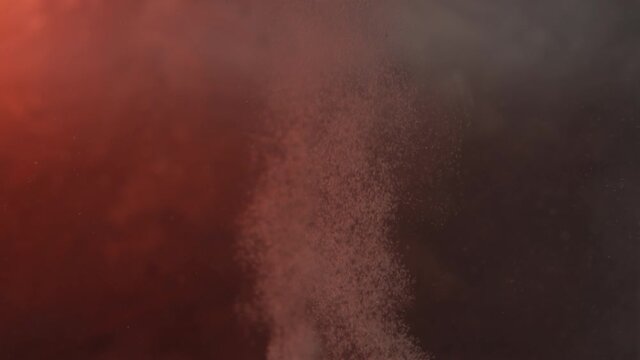Two fizzing tablets rise through frame in slow motion against a textured background lit with lava color.
