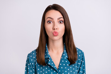 Fototapeta premium Photo of flirty brunette hair young lady blow kiss wear blue shirt isolated on grey color background