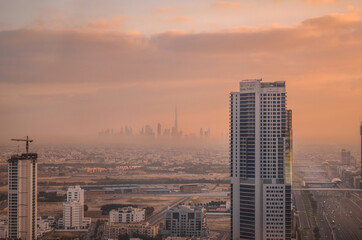 Stunning skyline view of Dubai Downtown from the outskirts of the city in early morning, showing a beautiful skyscraper's cluster.