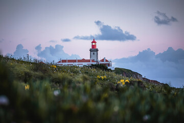 Picturesque landscape with a lighthouse at sunset in Sintra, Portugal