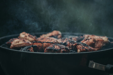 Cooking jerk chicken on the barbecue in the hills of Jamaica.