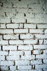An old vintage wall made of white brick.