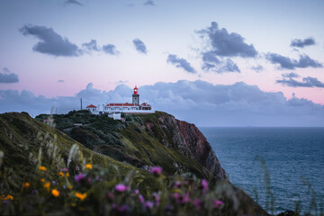 Fototapeta na wymiar Picturesque landscape with a lighthouse at sunset in Sintra, Portugal