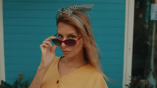 Portrait of a pretty young blonde woman in retro style