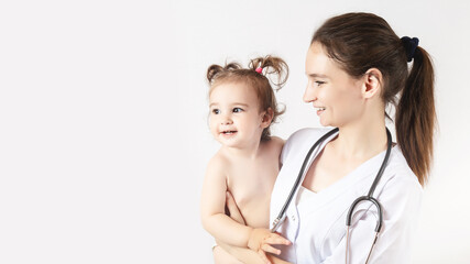 female doctor with happy smilling baby girl. copy space
