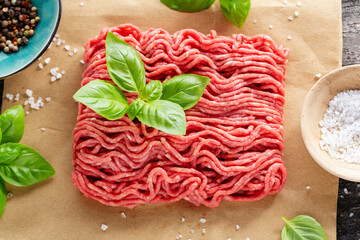 Minced meat with spices on table