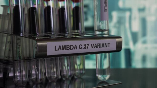 Lambda C37 Variant Test Tube Samples Being Removed From Rack.  Locked Off
