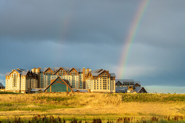 The stormy sky and rainbow above the new Gaylord Rockies Resort and Convention Center in Denver, Colorado