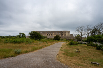 Fototapeta na wymiar An old castle with a dramatic sky in the background. Borgholm castle ruins on the Baltic Sea island Oland