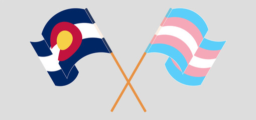 Crossed and waving flags of The State of Colorado and Transgender Pride