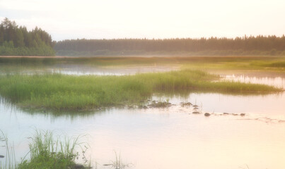 Beautiful morning landscape with a river, with dew and fog