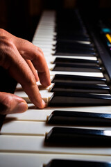 Fototapeta na wymiar Close Up Of a human or person fingers or hand Playing Piano. Man playing musical instrument concept.