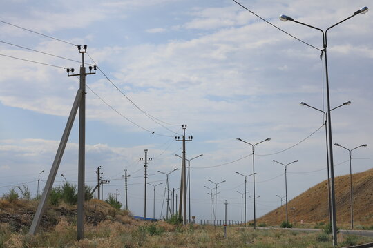 highway with lighting poles during the day