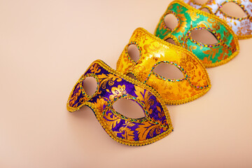 Carnival masks on color background. Purim celebration concept (jewish carnival holiday). Masquerade party or celebration concept.