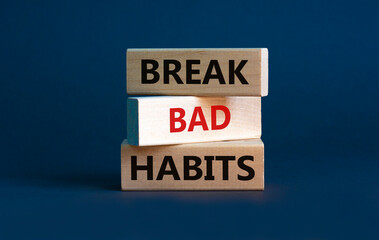 Break bad habits symbol. Wooden blocks with words 'break bad habits'. Beautiful grey background,...