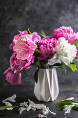 Fresh Peony flowers in vase. bouquet close up. Stylish floral greeting card.
