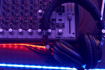 DJ mixing console with headphones