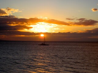 sailboat sunset in the sea