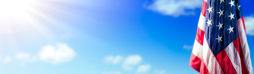 American Flag With Blue Sky And Sunlight - Memorial Day, 4th of July, Labor Day Background