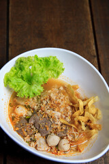 Thai food Spicy TOM YAM pork noodle soup with lemongrass, chilly pasted and lime juice