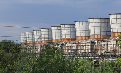 Obraz premium coolers from industrial chimneys on the landscape