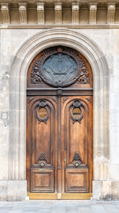 Paris, an ancient wooden door, typical building in the 9th arrondissement
