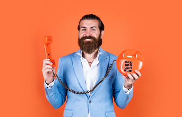 well groomed man in wedding formalwear has beard use retro phone, communication