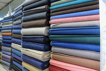 dowry and dress fabrics in accordance with Turkish traditions. bridal fabrics. Colorful fabrics were lined up on the shelves of the fabric store. selective focus