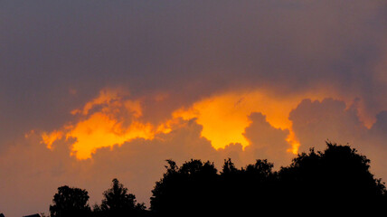 Orange sky with clouds during sunset