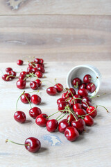 Fresh ripe red berries on a bowl on the rustic background