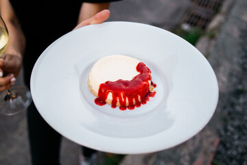 panna cotta with strawberry jam  on a plate