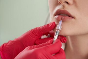 Close up view of lip Augmentation. Woman Getting Beauty Injection For Lips