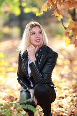 portrait of a beautiful girl close-up in the autumn garden