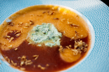 gazpacho soup in blue plate