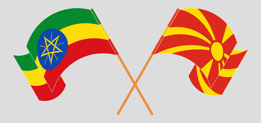 Crossed and waving flags of Ethiopia and North Macedonia