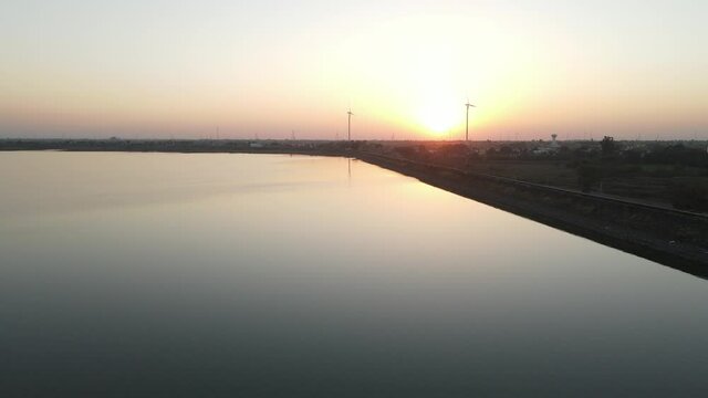 dam water aerial view taken from 300 meters above the surface. Amazing Aerial sunset view of Dam. 4k resolution.