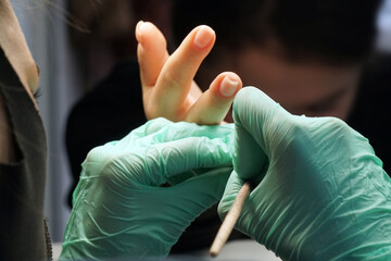 working as a manicure master in a nail salon