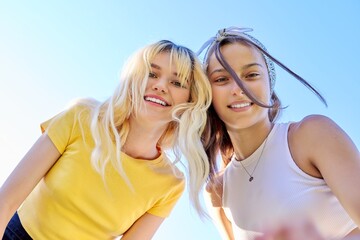 Close-up of happy smiling faces of teenage girls
