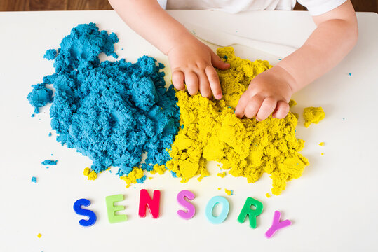 Sensory word and magic kinetic sand. Early sensory education. Kidd's sensory experiences, games and play for fine motor skills. Therapy hand, development of fine motor, autism, occupational therapy