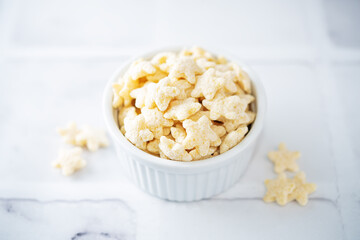 Dried wheat stars for breakfast in a bowl