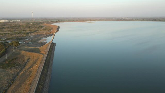 dam water aerial view taken from 300 meters above the surface. Amazing Aerial sunset view of Dam. 4k resolution.