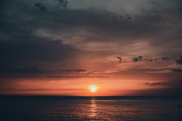 Beautiful sunrise by the sea on a warm summer day.