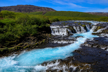 Fototapeta na wymiar The beautiful blue Bruarfoss waterfall, Iceland
