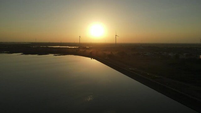 dam water aerial view taken from 300 meters above the surface. Amazing Aerial sunset view of Dam. 4k resolution.