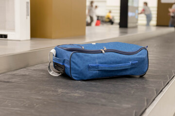 Baggage claim. Luggage close-up on a conveyor belt at the international airport. The concept of...