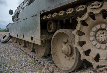 Fototapeta na wymiar close up of the left track with a repair wheel on a British Army Challenger Armored Repair and Recovery Vehicle (CRARRV) on a military training exercise, salisbury plain wiltshire