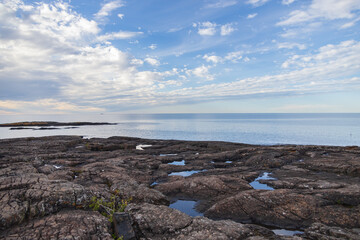 Fototapeta na wymiar Lake Superior with blue sky and white clouds, Michigan, USA