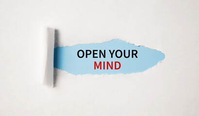 Open Your Mind appearing behind torn white paper.Be creative, motivational concept